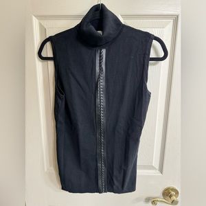 Carmen sleeveless turtleneck with leather-like accent in front